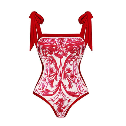 Un maillot de bain une pièce Rouge Femme avec un motif floral orné et de très beaux nœuds sur les épaules par BREEZE BEEZ.