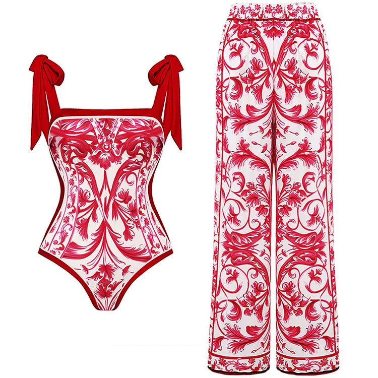 Un Maillot de Bain Rouge Femme unique et confortable avec un motif floral orné de rouge et blanc associé à un pantalon palazzo taille haute assorti, parfait pour les vacances par BREEZE BEEZ.