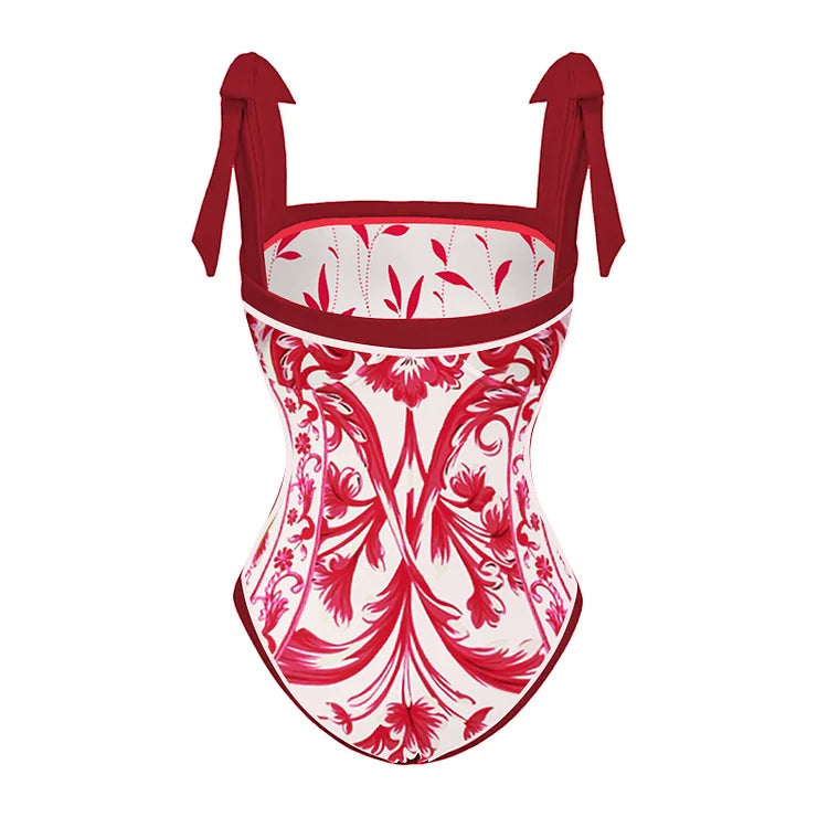 Un Maillot de bain Rouge Femme fleuri rouge et blanc de la collection BREEZE BEEZ avec des bretelles à nouer et un design classique.