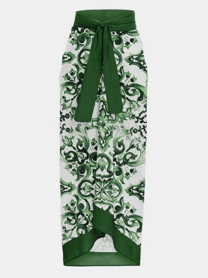 Élégante jupe crayon taille haute avec un motif baroque vert et blanc audacieux, accentuée par un détail noué confortable à la taille de BREEZE BEEZ.