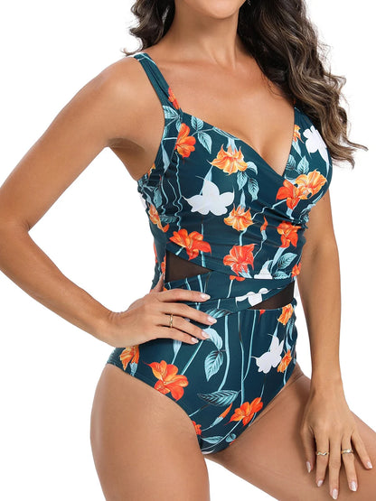 Un modèle présentant un maillot de bain vert 1 pièce élégant floral BREEZE BEEZ avec un décolleté plongeant et des détails découpés en maille.