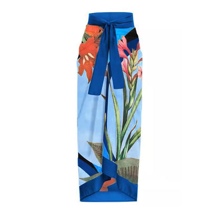 Pantalon bleu fleuri taille haute avec ceinture à nouer, imprimé tropical et confortable pour profiter des vacances. Essayez le Maillot de Bain Femme de BREEZE BEEZ - Gainant Ventre Plat & Dos nu !